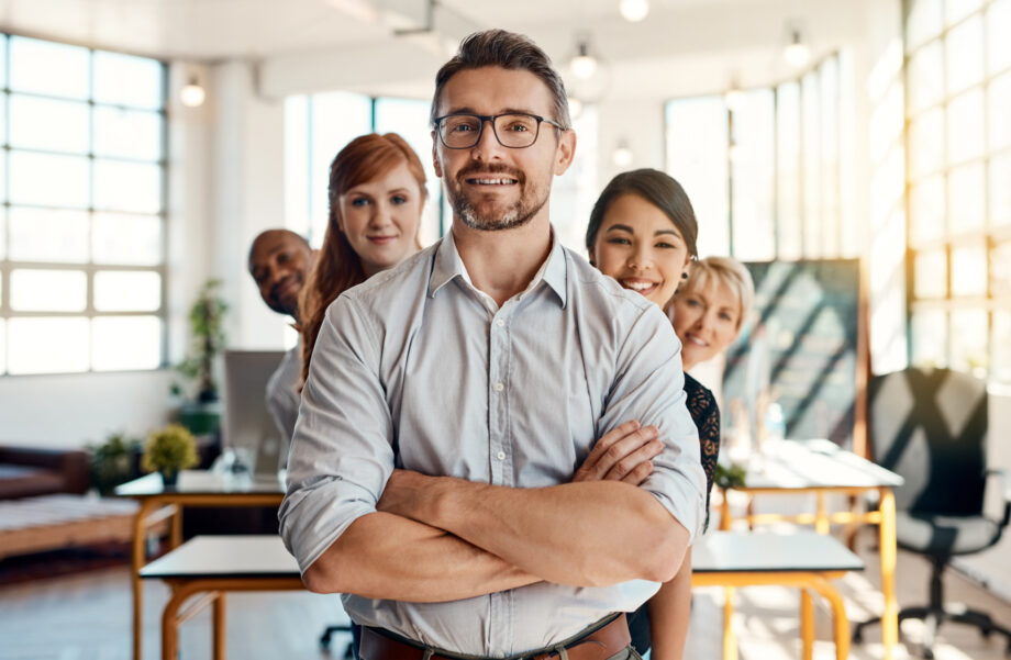 Portrait, group and people with confidence in office for collaboration, leadership or about us of partnership. Smile, diversity and arms crossed for teamwork, career opportunity or support of company.